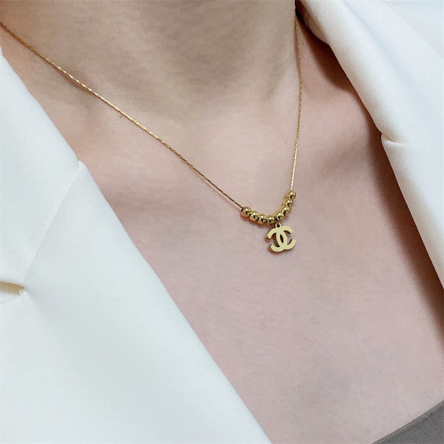 シャネル ダブルC イエローゴールド ビーズ ペンダント ネックレス