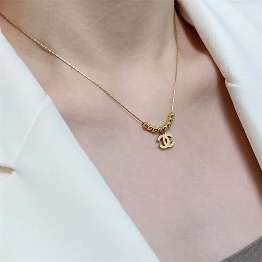 シャネル ダブルC イエローゴールド ビーズ ペンダント ネックレス